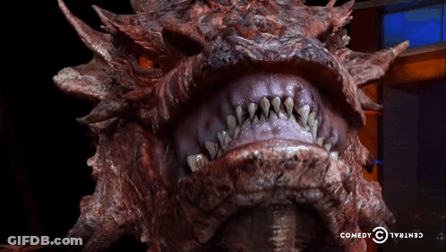 Dragon Head Close Up With Comedy Central Logo GIF