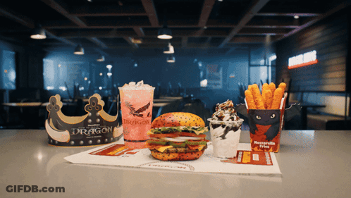 Dragon Word On Cup Next To Burger GIF