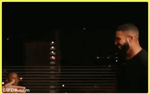 Drake And Chris Brown Are Shaking Hands In A Dark Room . GIF