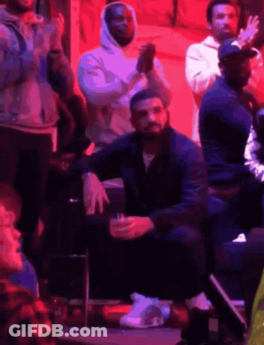 Drake Sitting In Stands With Drink GIF