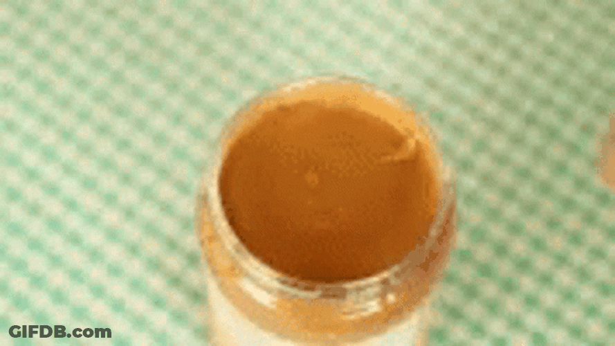 Drawing Sad Face Over Peanut Butter GIF