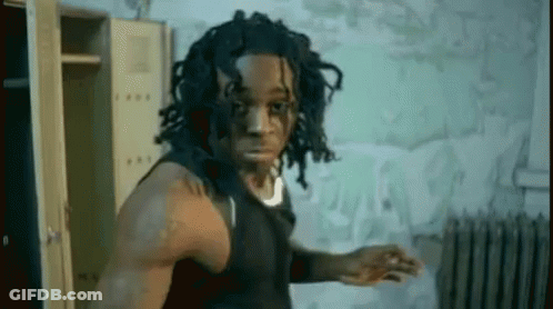 Dreadlocked Man Among Lockers And Radiator GIF