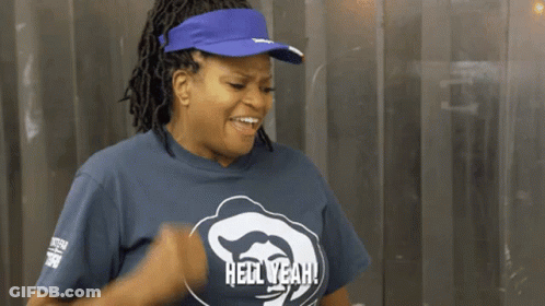 Dreadlocked Man Covers Mouth While Another Laughs GIF