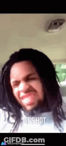 Dreadlocked Man Funny Face Saying It's Hot GIF
