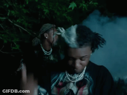 Dreadlocked Man In Black Skull Shirt And Necklace GIF