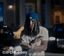 Dreadlocked Man In Blue Hat GIF