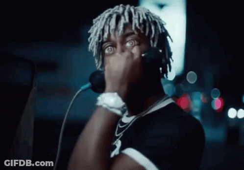 Dreadlocked Man Singing Into Microphone With Headphones GIF