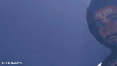 Dreadlocked Man With Forehead Symbol At Camera GIF