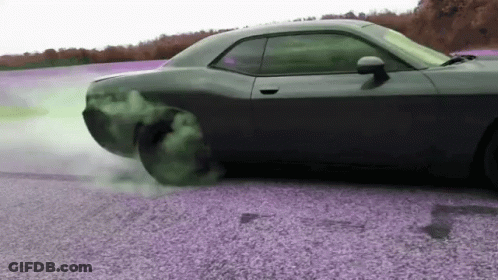 Drifting Car On Gravel Road With Smoking Tire GIF