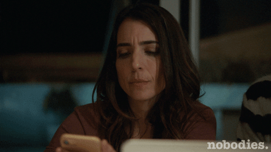 Drinking Wine While Looking At Phone GIF