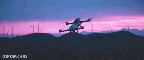Drone Flying Over Windmill Field GIF