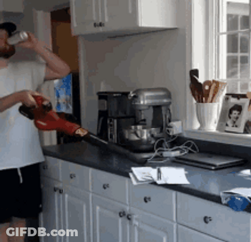 Drunk Guy Cleaning The Papers With Vacuum GIF