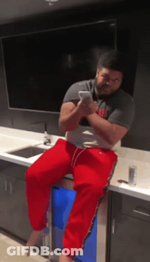 Druski We Got Em Holding Cellphone Sitting GIF