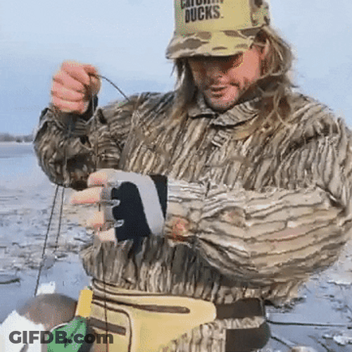 Duck Hunting Man With Plastic Duck Baits GIF