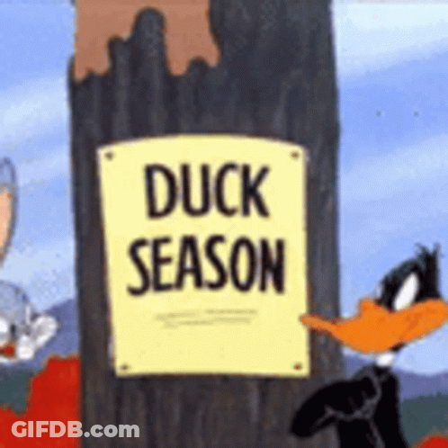 Duck Season Sign Next To Tree GIF