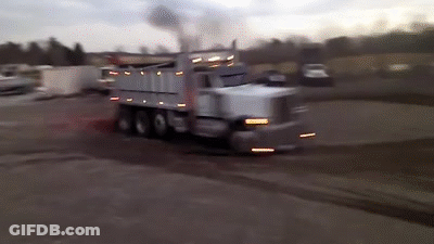 Dump Truck Driving With Smoke From Back GIF