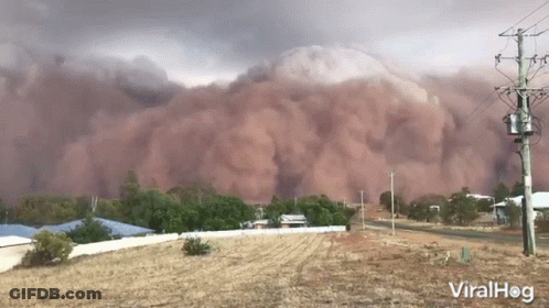Dust Cloud Coming Down Hill GIF