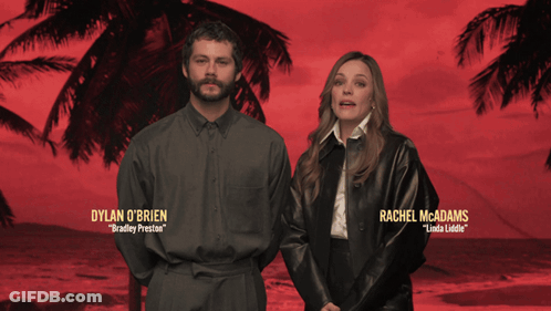 Dylan O'brien And Rachel Mcadams Are Standing Next To Each Other In Front Of Palm Trees GIF