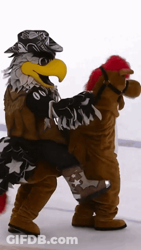 Eagle Mascot Carrying Stuffed Horse With Red Mane GIF