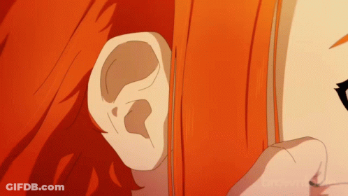 Ear Close-Up With Brown Text GIF