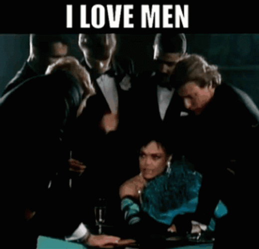 Eartha Kitt Surrounded By Many Men GIF