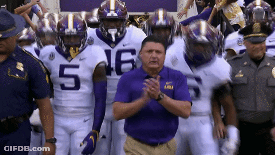Ed Orgeron Clapping While Walking With Players GIF