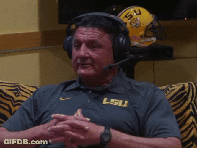 Ed Orgeron Laughing While Wearing Headset GIF