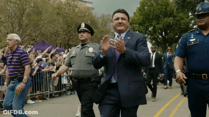 Ed Orgeron Walking With Cops On Side GIF