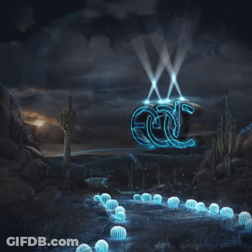 EDC Sign Lit Up In Desert GIF