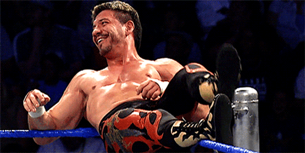 Eddie Guerrero Chilling On Top Of Ring GIF