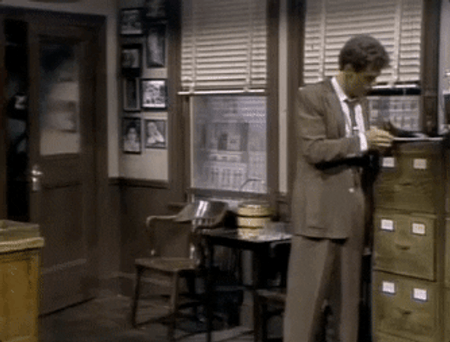 Eddie Murphy Entering Office In Gumby Suit GIF