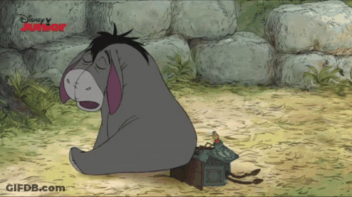 Eeyore Sitting In Dirt Next To Disney Junior Sign GIF