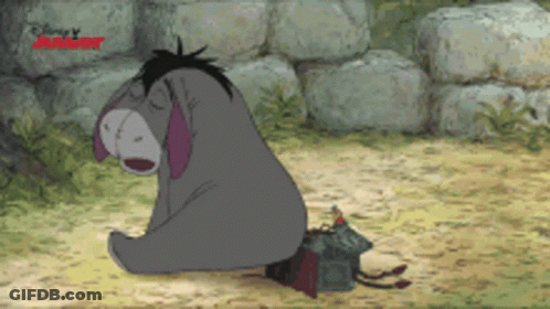 Eeyore Sitting On Ground With Disney Logo GIF