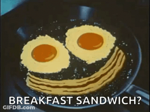 Eggs And Bacon In Smiley Face Frying Pan GIF