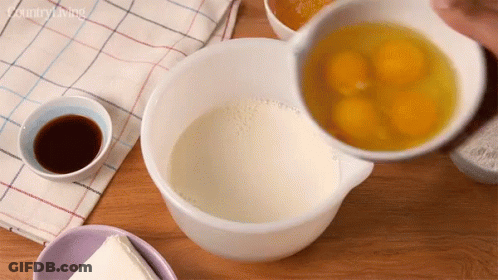 Eggs Poured Into Bowl Of Milk With Country Living Logo GIF