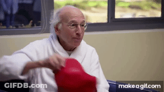 Elderly Man In Robe Holding Red Hat GIF