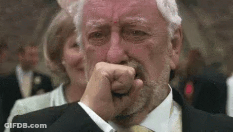 Elderly Man In Suit Crying Covering Mouth GIF