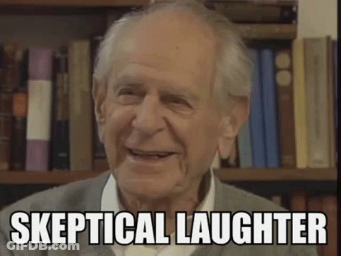 Elderly Man Smiling In Front Of Bookshelf Saying Skeptical Laughter GIF