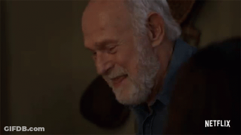 Elderly Man With Beard Hands On Forehead GIF