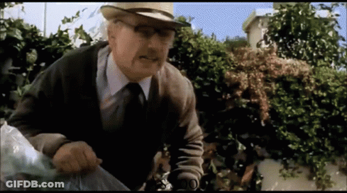 Elderly Man With Hat Glasses Holding Plastic Bag GIF