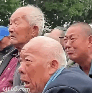 Elderly Men Sitting In A Crowd GIF