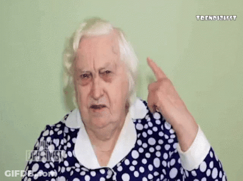 Elderly Woman Blue-And-White Polka Dot Dress Covering Ear GIF