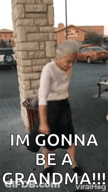 Elderly Woman Dancing On Sidewalk By Brick Building GIF