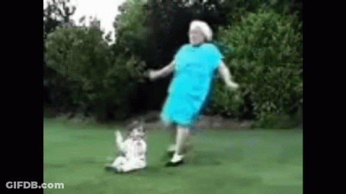 Elderly Woman Dancing With Girl In Field GIF