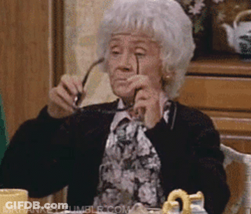 Elderly Woman Holding Glasses GIF