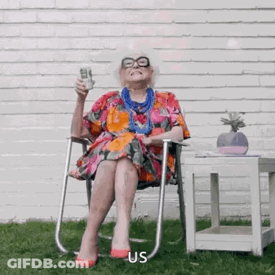 Elderly Woman Holding Wine And Stack Of Money GIF