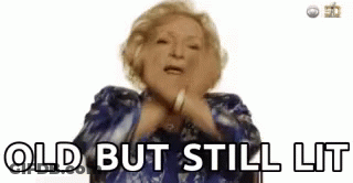 Elderly Woman In Blue Jacket Saying Old But Still Lit GIF