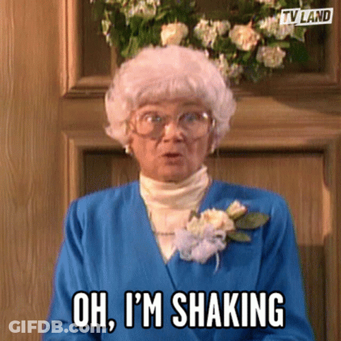 Elderly Woman In Blue Jacket Shaking Head GIF