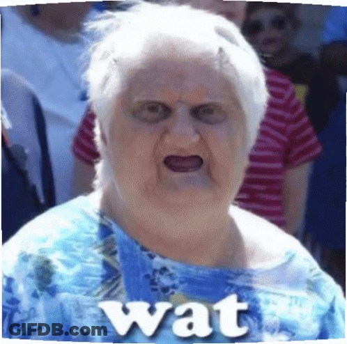 Elderly Woman In Blue Shirt With Wat On Chest GIF