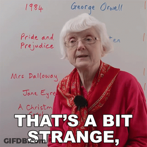 Elderly Woman In Front Of Whiteboard Saying Pride And Prejudice 1984 George Orwell GIF